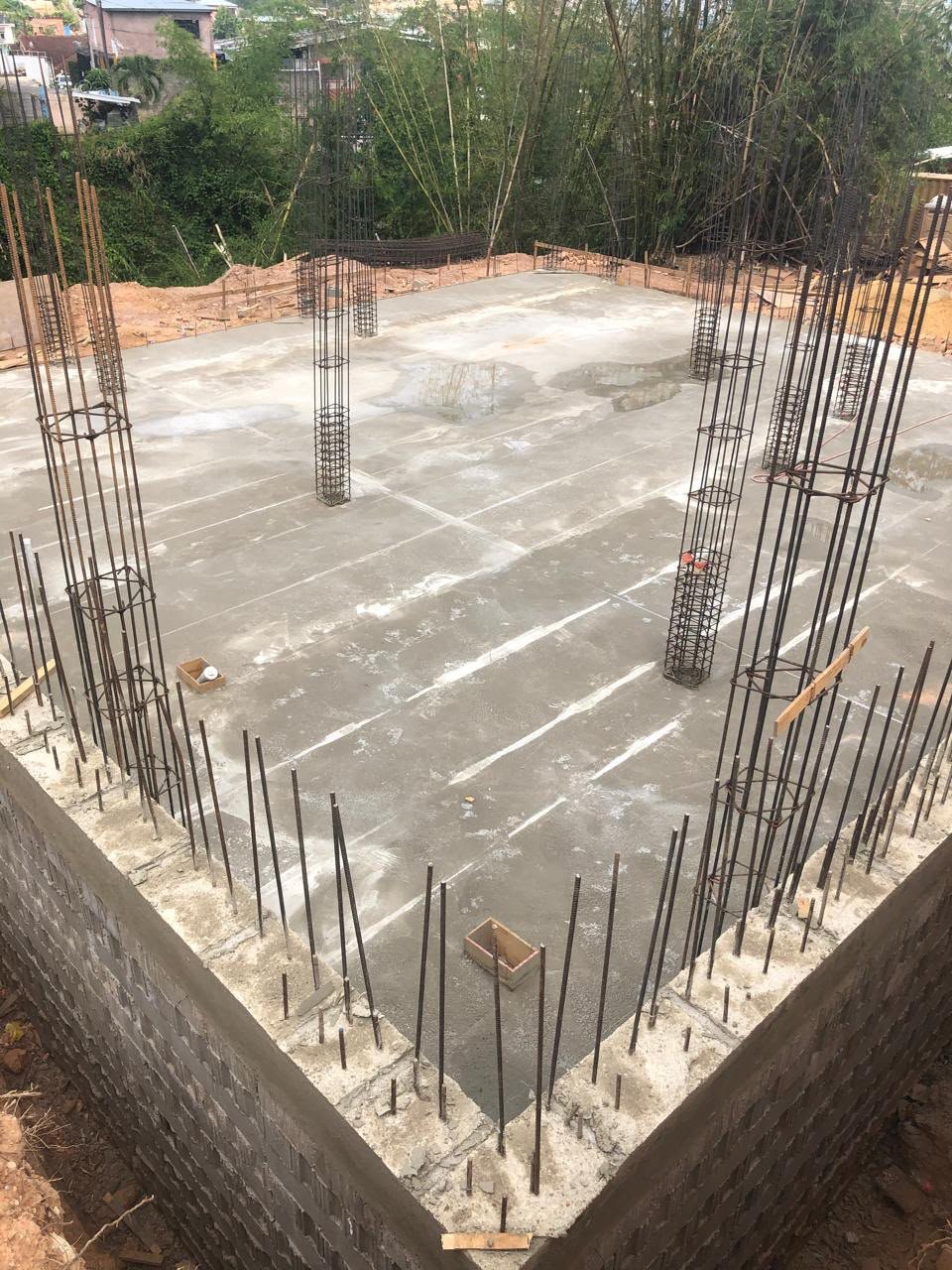 MXCT Enterprise structural construction site with reinforced concrete columns